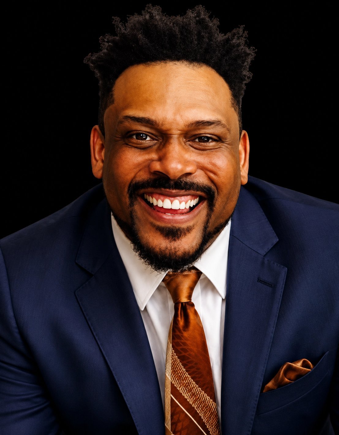 Headshot of Daryl D. Brooks in a navy suit and copper tie