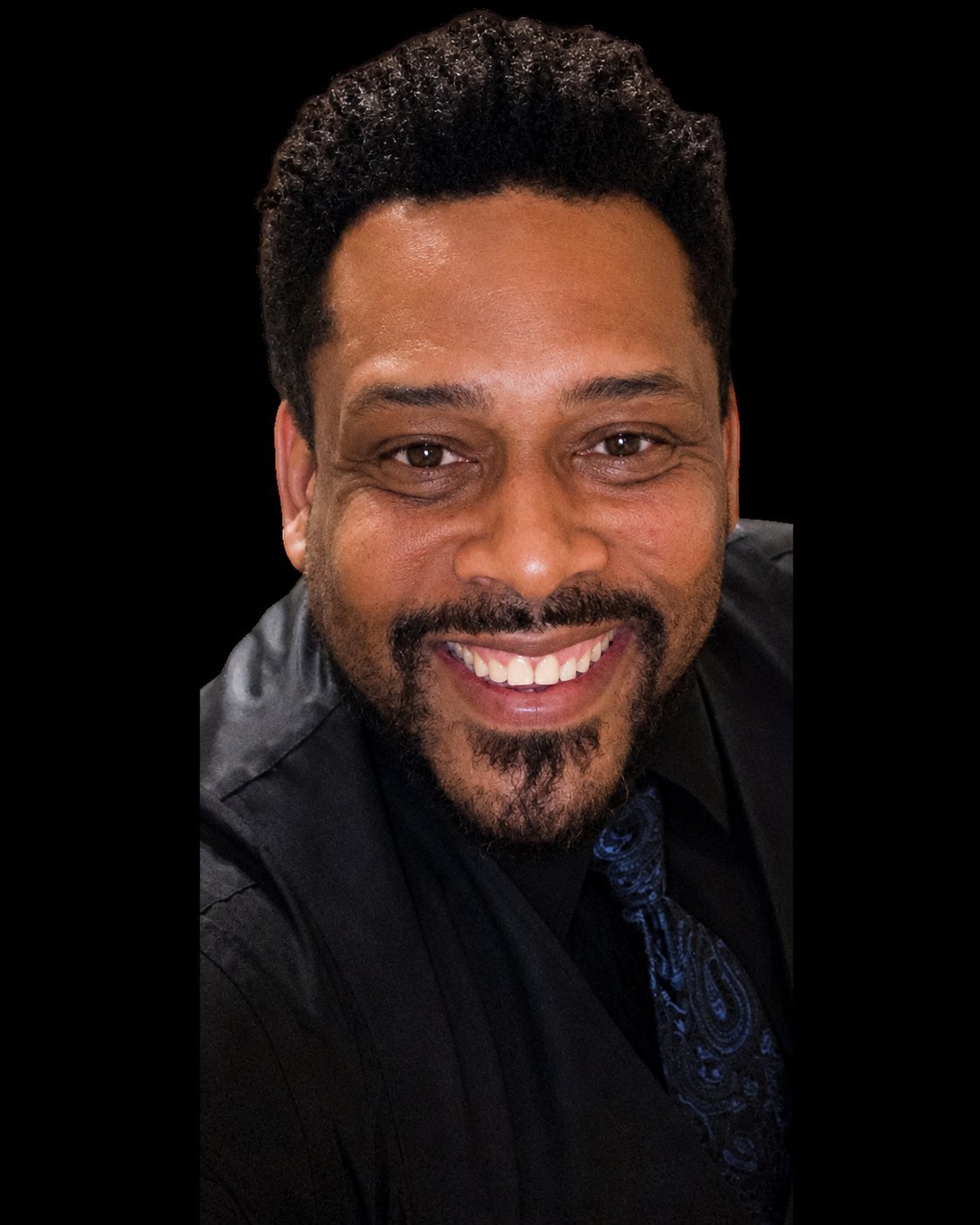 Headshot of Daryl D. Brooks in a black vest