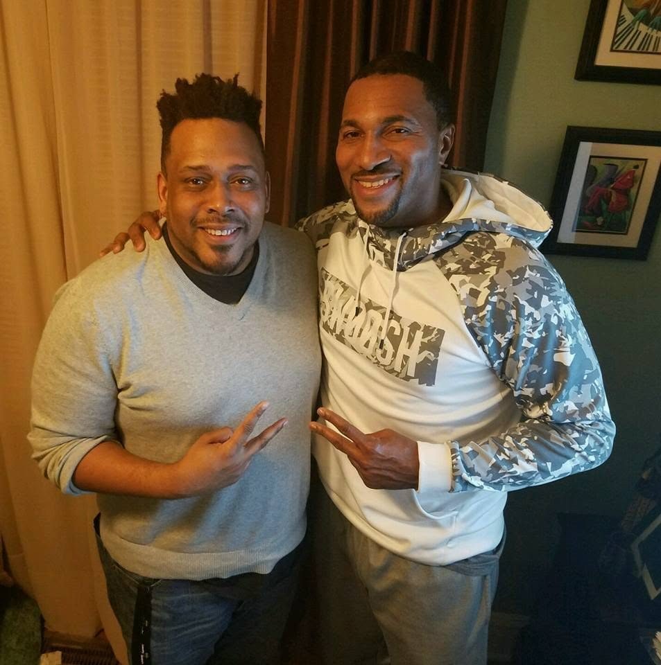 Daryl D. Brooks and a friend flashing peace signs